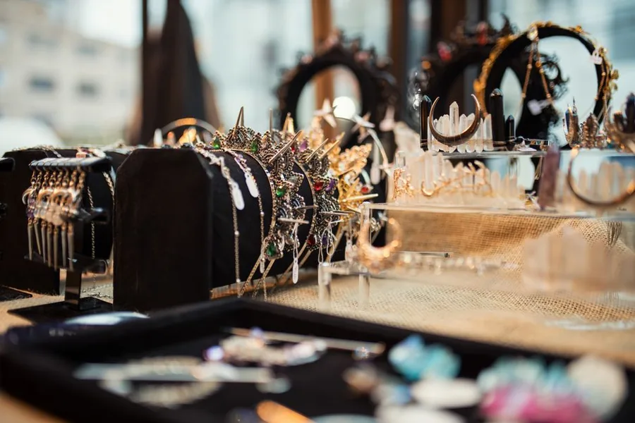 Necklaces and jewelled tiaras arranged on display stands in a jeweller's boutique Necklaces and jewelled tiaras arranged on display stands in a jeweller's boutique