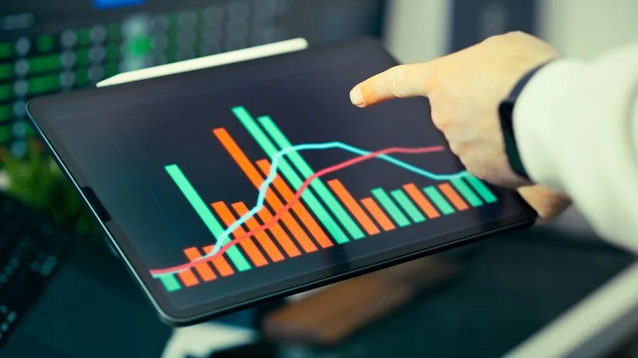 Reviewing quarterly financial figures on a tablet, the kind of digital record-keeping Making Tax Digital for Income Tax now requires Reviewing quarterly financial figures on a tablet, the kind of digital record-keeping Making Tax Digital for Income Tax now requires