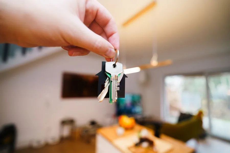 A landlord holding the keys to a rental home, the kind of property owner who may qualify for a digital exclusion exemption from Making Tax Digital A landlord holding the keys to a rental home, the kind of property owner who may qualify for a digital exclusion exemption from Making Tax Digital