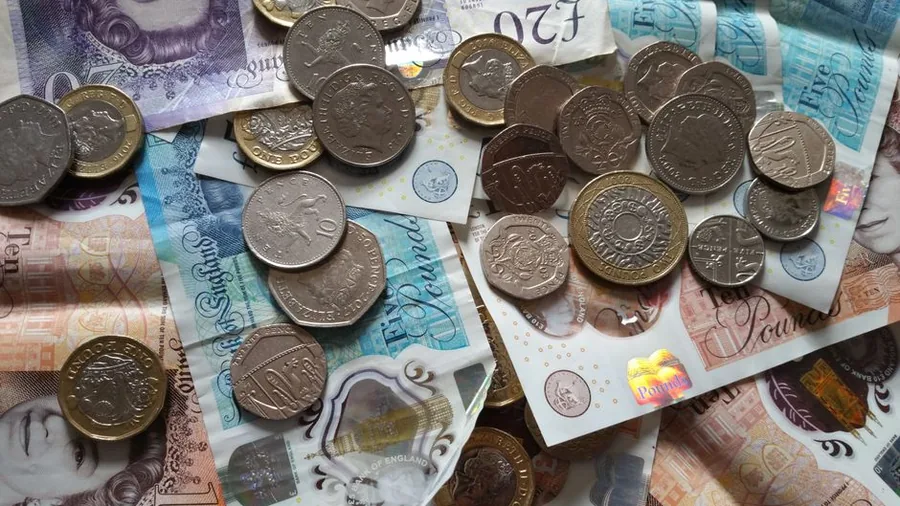Rising stacks of British pound coins, illustrating income that builds up steadily over time Rising stacks of British pound coins, illustrating income that builds up steadily over time