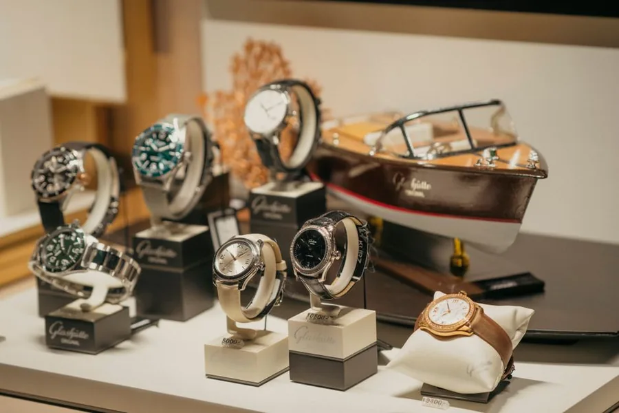 Pre-owned luxury watches displayed with price tags in a specialist dealer's cabinet, the setting where the VAT margin scheme applies Pre-owned luxury watches displayed with price tags in a specialist dealer's cabinet, the setting where the VAT margin scheme applies
