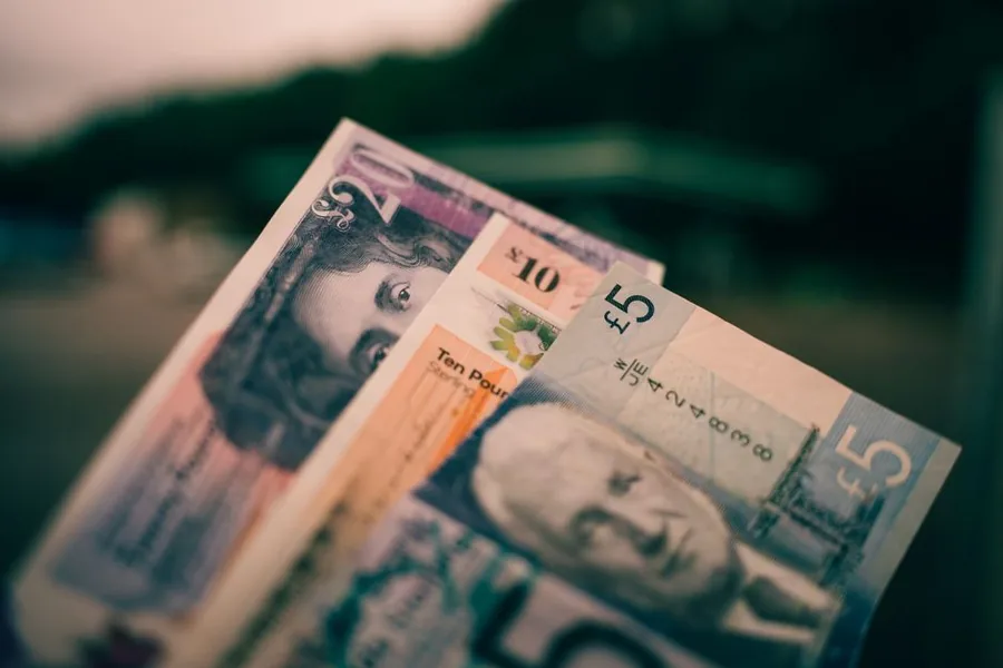 Sterling notes fanned out, representing the wages a UK company pays its employees each time it runs payroll Sterling notes fanned out, representing the wages a UK company pays its employees each time it runs payroll