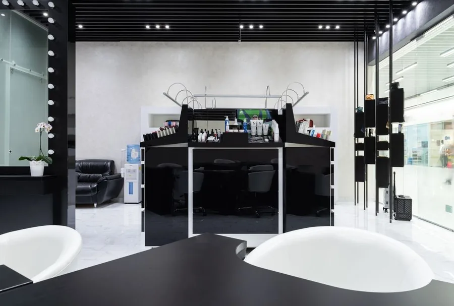 A hair stylist at work on a client, the kind of going concern whose goodwill is valued when a salon is sold A hair stylist at work on a client, the kind of going concern whose goodwill is valued when a salon is sold