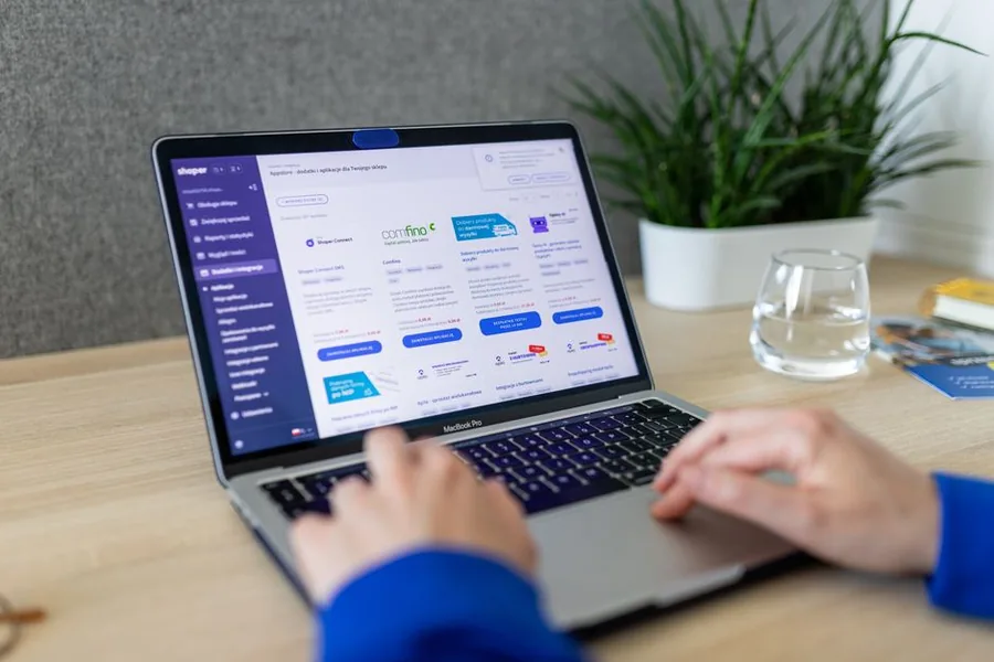 An online seller browsing ecommerce platform integrations and accounting apps on a laptop An online seller browsing ecommerce platform integrations and accounting apps on a laptop