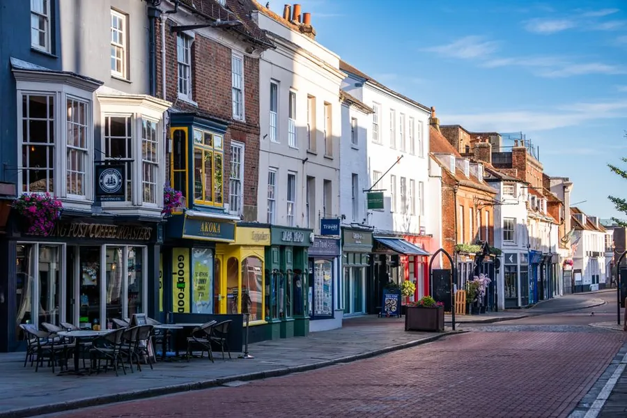 Independent shops and cafes lining a UK high street, the kind of small and medium enterprises covered by SME thresholds Independent shops and cafes lining a UK high street, the kind of small and medium enterprises covered by SME thresholds