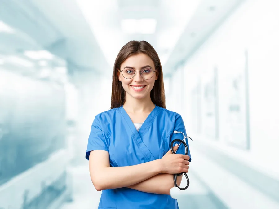 Nurse in blue scrubs holding a stethoscope in a bright hospital corridor, a uniformed worker whose tax code reflects job expenses Nurse in blue scrubs holding a stethoscope in a bright hospital corridor, a uniformed worker whose tax code reflects job expenses