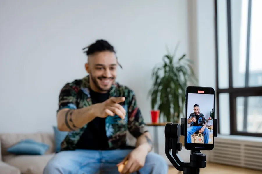 A creator running a live phone stream from home, the setting where viewers send gifts, coins and diamonds that HMRC may treat as taxable income A creator running a live phone stream from home, the setting where viewers send gifts, coins and diamonds that HMRC may treat as taxable income