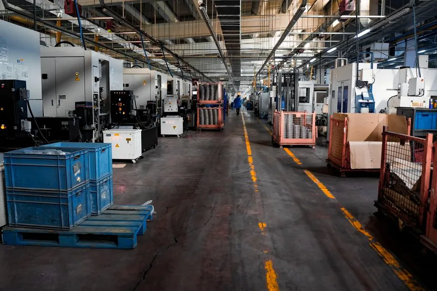 A modern UK factory floor lined with CNC machines, the kind of plant and machinery investment that capital allowances relieve A modern UK factory floor lined with CNC machines, the kind of plant and machinery investment that capital allowances relieve