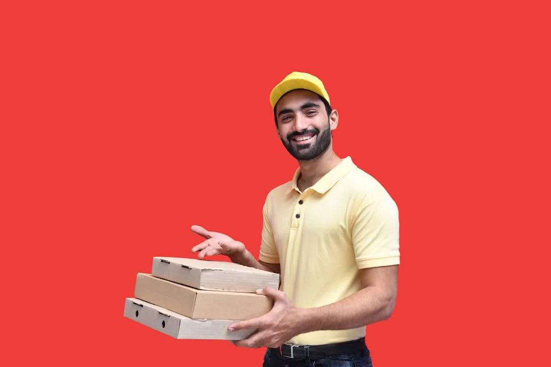 TikTok Shop seller at a desk reviewing returned parcels and a returns reserve in their accounts