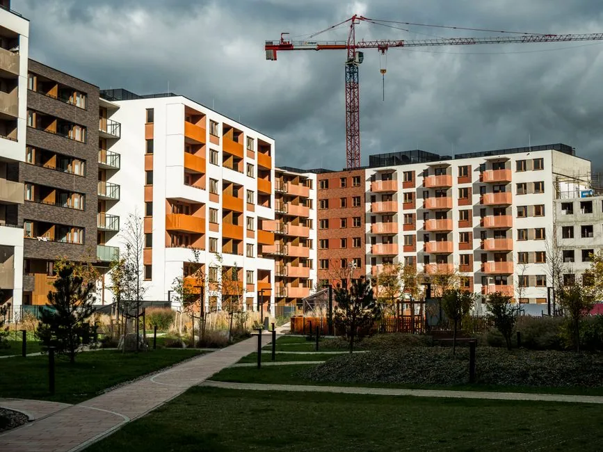 Newly built apartment blocks under construction with freshly laid lawns and planted grounds on the development Newly built apartment blocks under construction with freshly laid lawns and planted grounds on the development