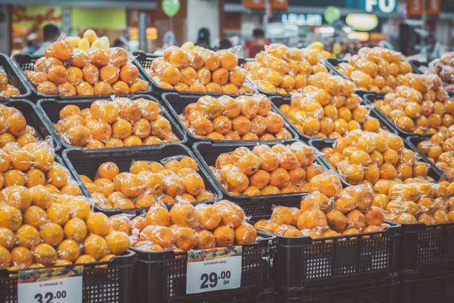 Price-tagged fresh produce stacked in a supermarket, showing how inflation drives up everyday grocery costs Price-tagged fresh produce stacked in a supermarket, showing how inflation drives up everyday grocery costs