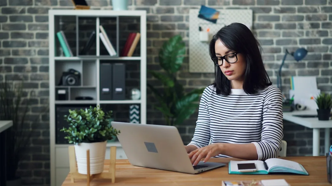 Two business owners reviewing company paperwork at a desk to understand their roles