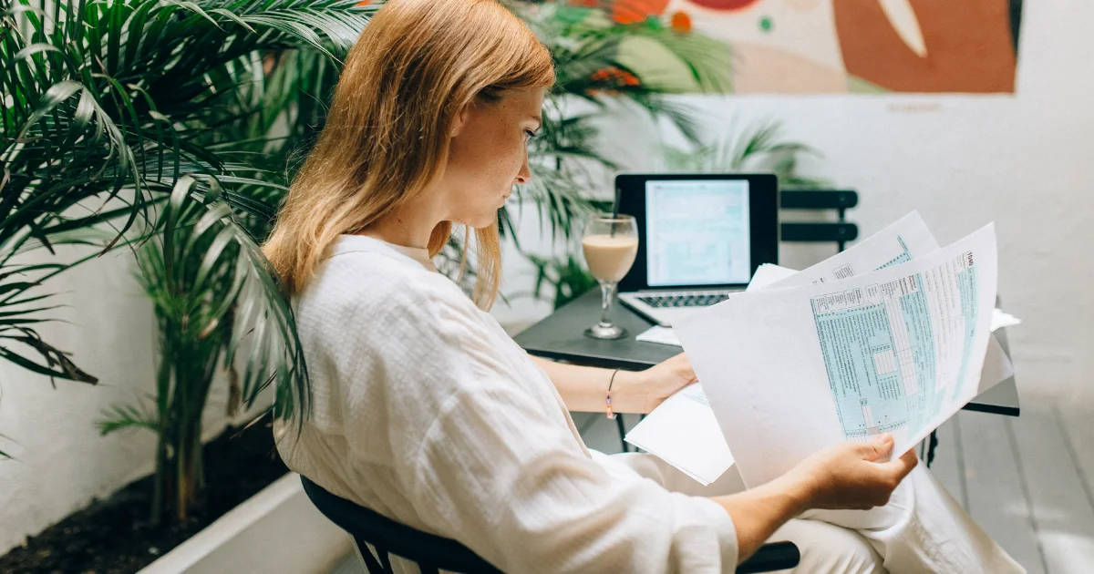 Business owner reviewing company expenses using accounting software.