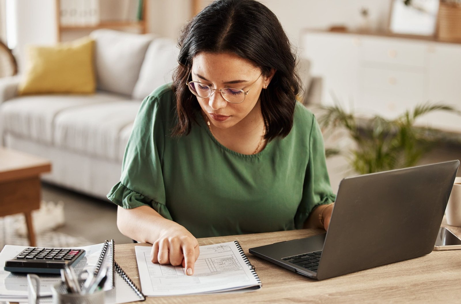 Woman working on a laptop for small business accounting