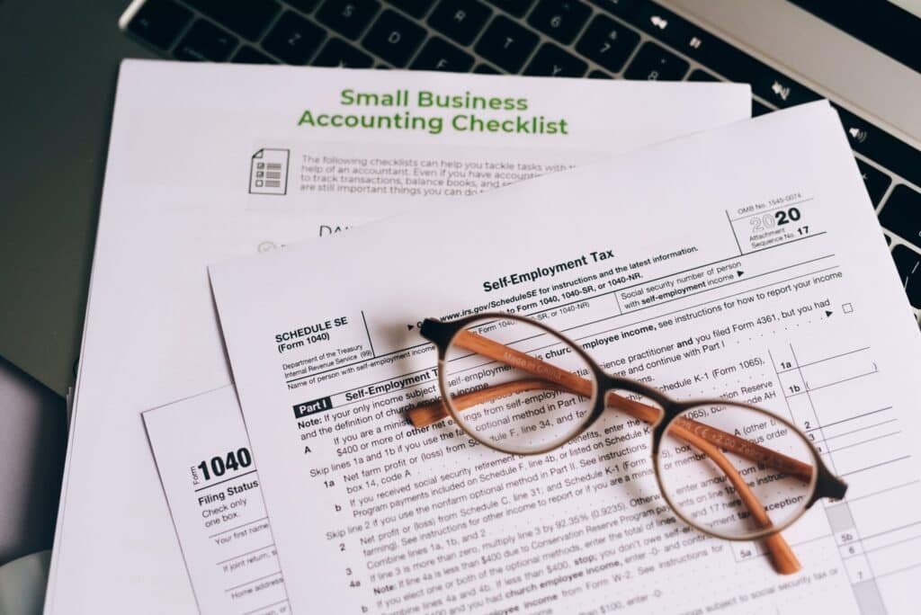 A close-up of small business accounting checklist with documents.