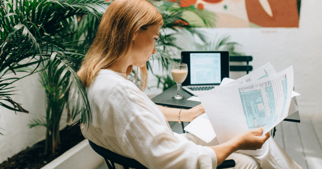 Business owner reviewing company expenses using accounting software.